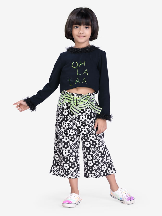 Striped flared 3/4th pants with fun black and white print for girls.